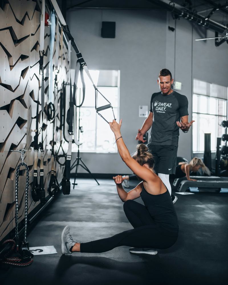 Suspension trainer session with a coach